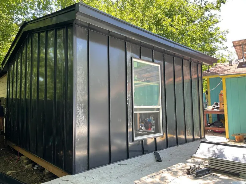 Black standing seam metal wall panels for Roof Inspection in Greenwood Village