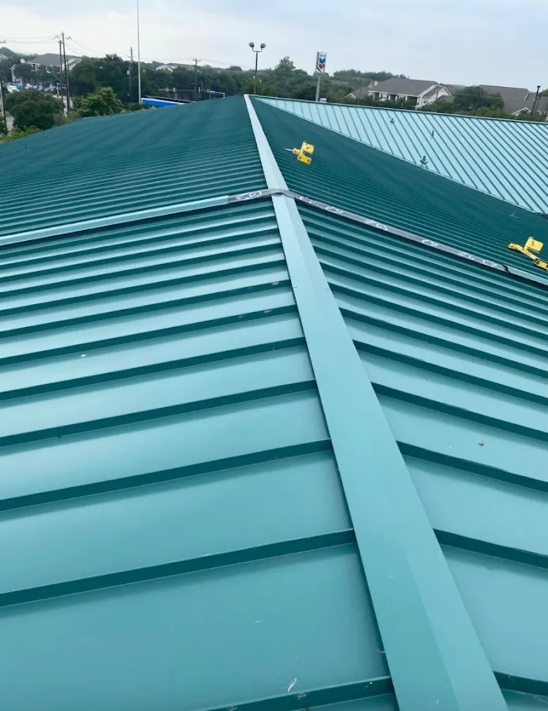 Green commercial metal roof ridge and valley for Metal Roof Repair in Greenwood Village