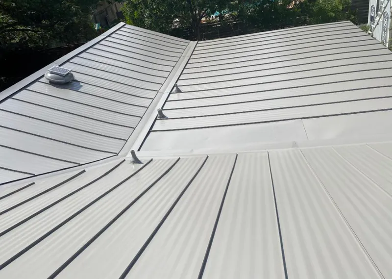 Solar attic fan installed on a metal roof for Roof Ventilation in Greenwood Village